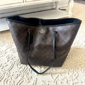 Coach shoulder bag, large. Black and brown with gold hardware.